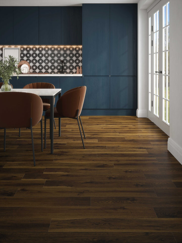 Smoked Cathedral Oak Plank Aqua 72 12mm AC5 Laminate Flooring installed in a kitchen