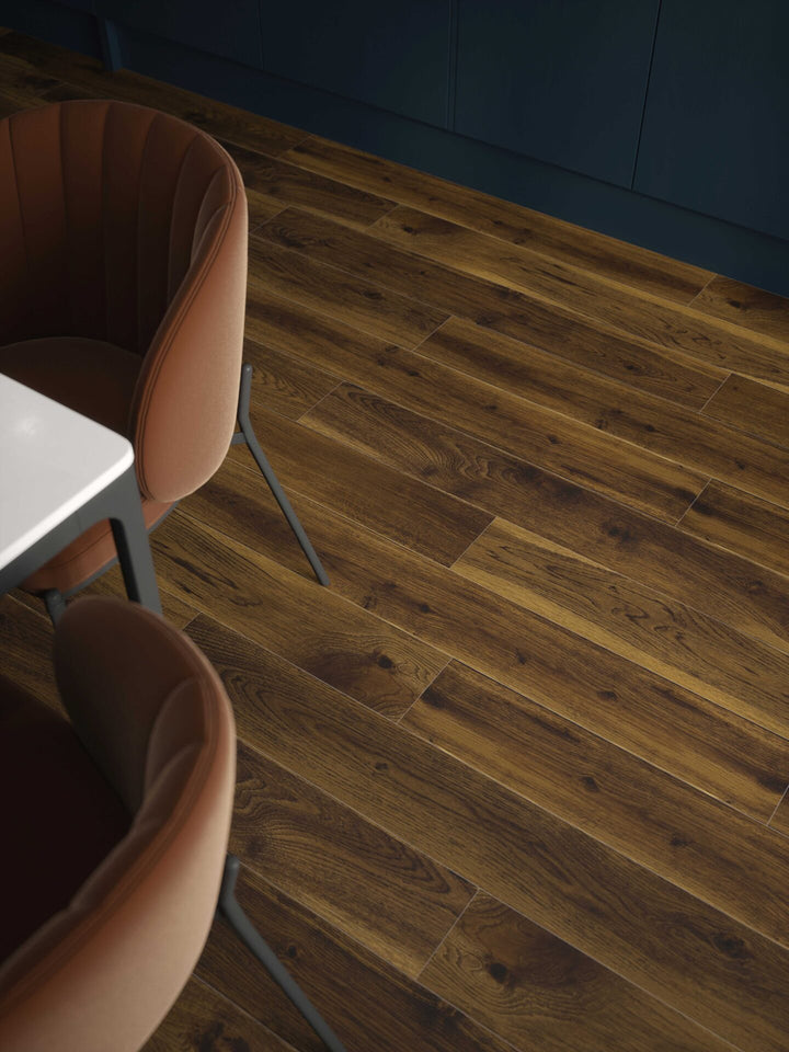 Smoked Cathedral Oak Plank Aqua 72 12mm AC5 Laminate Flooring installed in a kitchen