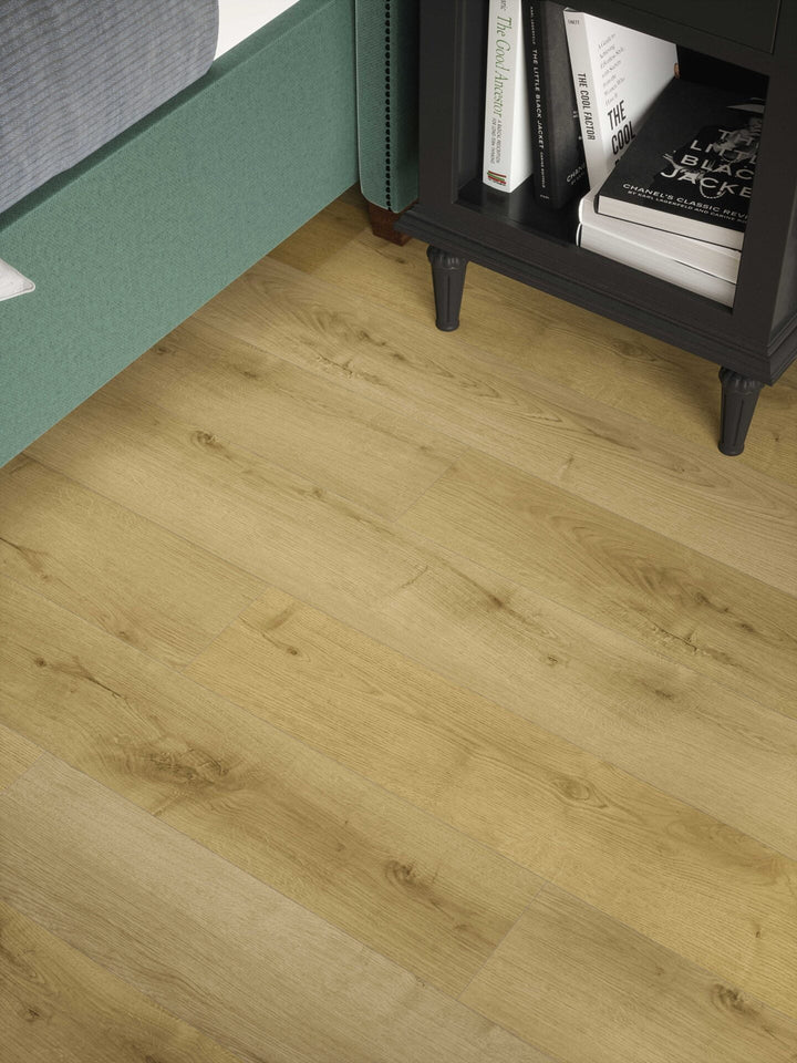 Privas Oak Plank 12mm AC4 Laminate Flooring installed in a bedroom