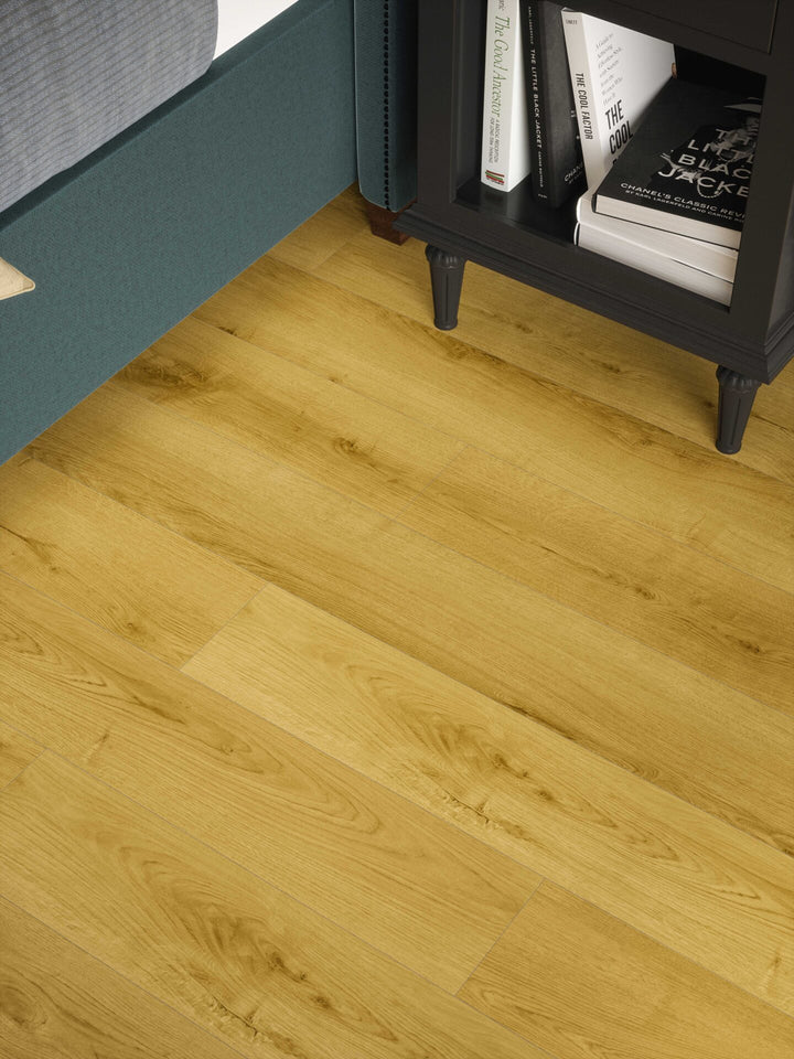 Albi Honey Oak Plank 12mm AC4 Laminate Flooring installed in a bedroom