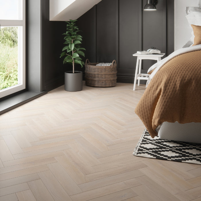 Larissa Oak 12mm AC4 herringbone laminate flooring room setting