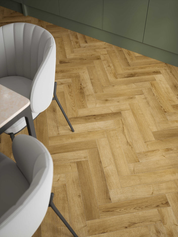 Stade Oak 12mm AC4 herringbone laminate flooring installed in a kitchen