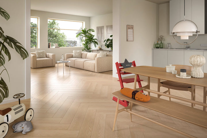 Sand Baronia Oak 8mm herringbone laminate flooring room view