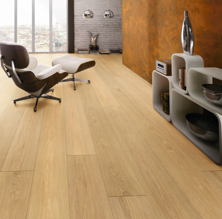 Honey Montreux Oak Long Plank Aqua Plus 12mm AC5 Laminate Flooring installed in a room