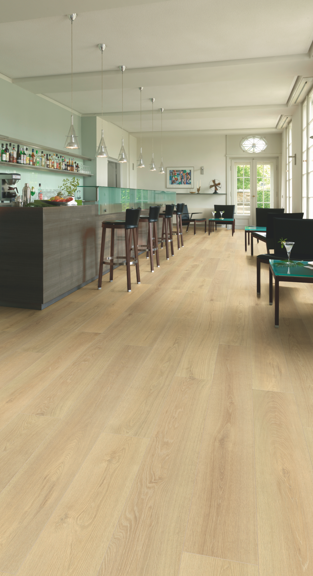 Blonde Montreux Oak Long Plank Aqua Plus 12mm AC5 Laminate Flooring installed in a room